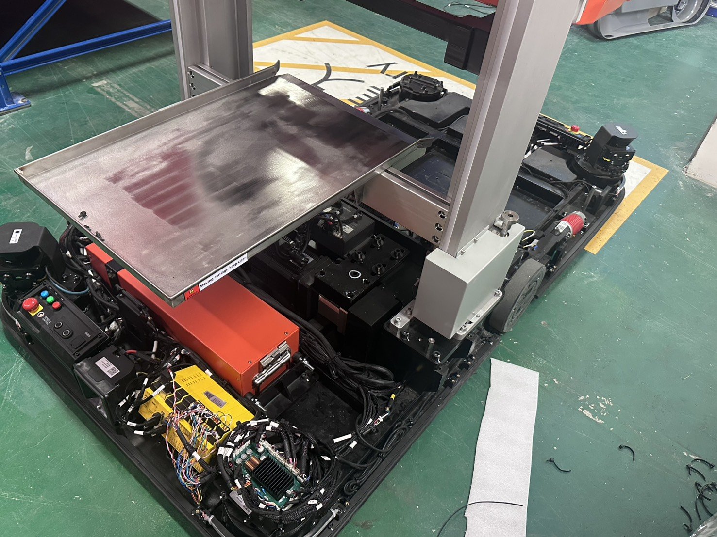 AGV internals — drive system, battery, control board.